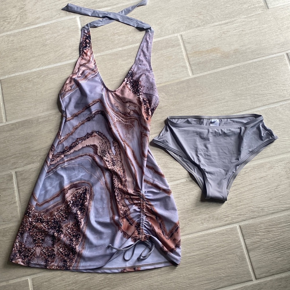 Bathing suit dress with bottoms. Great design. Very comfortable. Size S